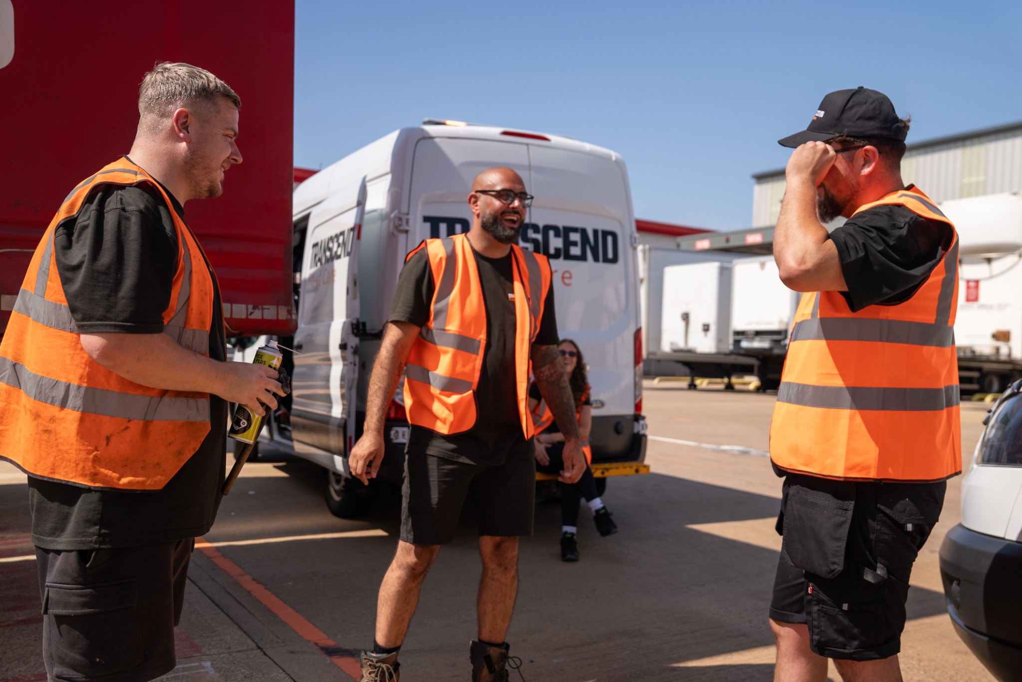 Transcend Fleet Care technicians working together at a customer site